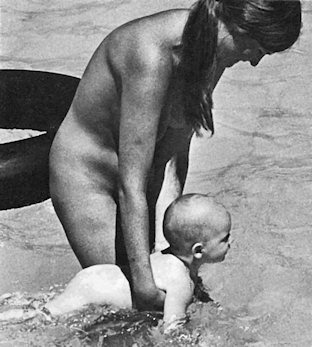 Mum with baby in a pool
